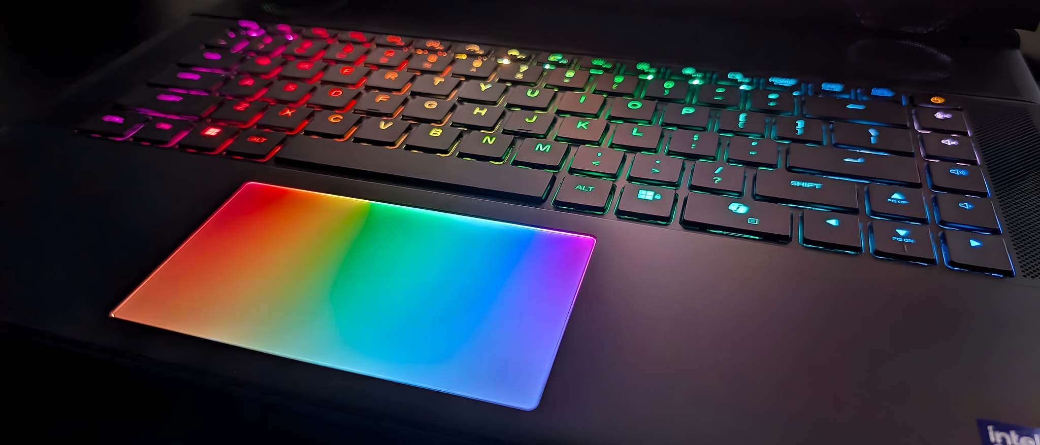 Closeup of the Alienware Area-51 16 Gaming Laptop's keyboard and RGB touchpad. 