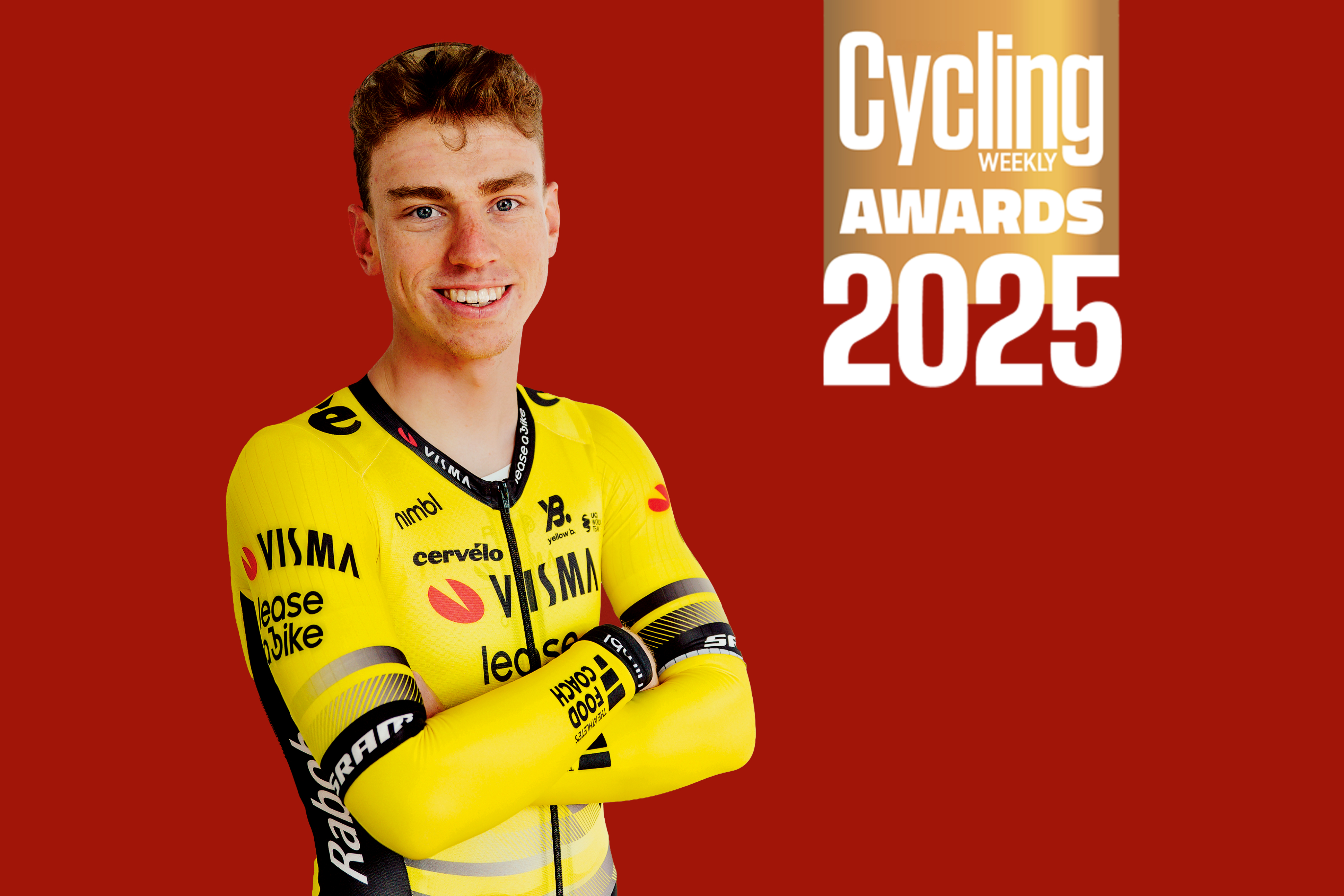 Matthew Brennan stood against a red background