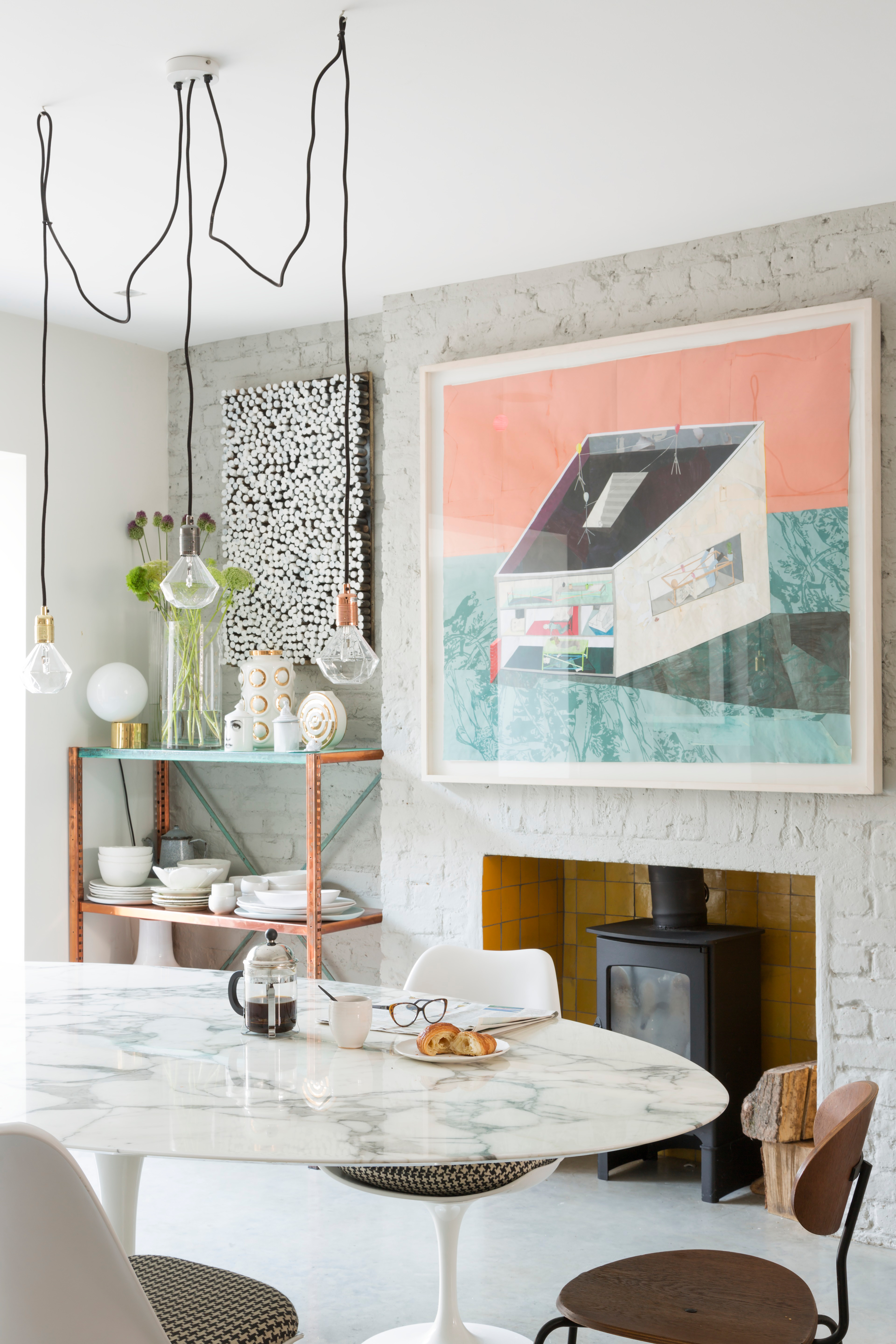 White dining room with exposed brick white wall