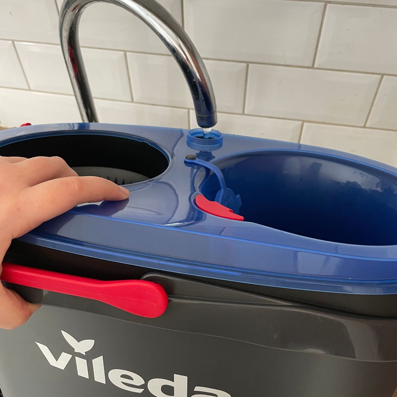 Filling the Vileda RinseClean Spin Mop &amp; Bucket System with water from a silver tap