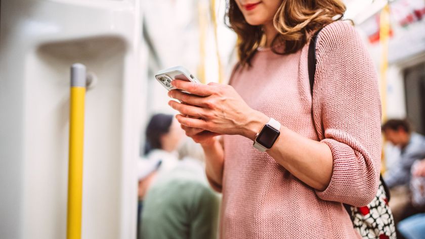 a woman using her smart phone while riding on a public transit train. The scene captures modern urban life, with its focus on staying connected through mobile technology during commutes. Concepts of travel, urban living and digital connectivity.