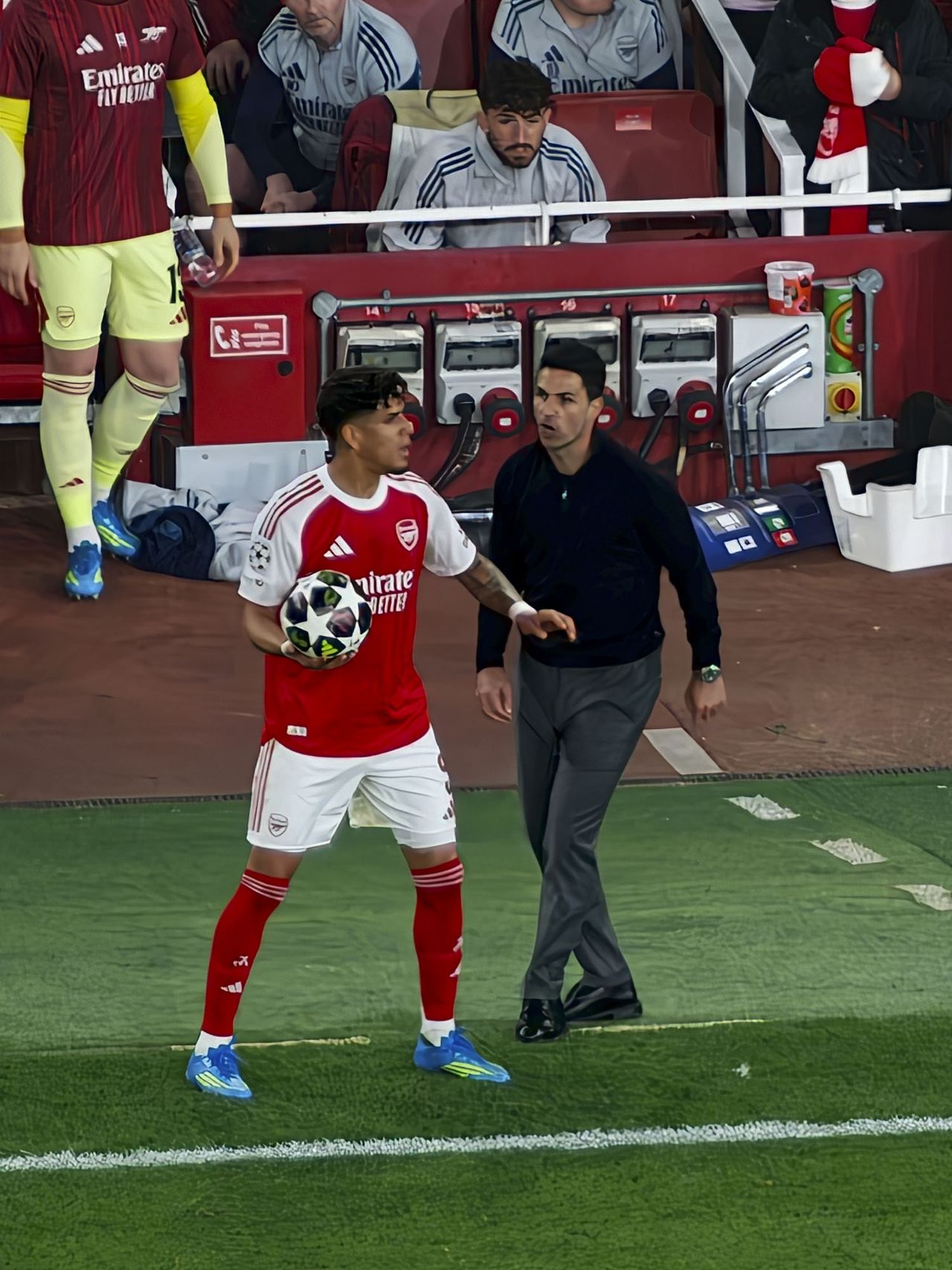 Action photos during a Champions League soccer match at Arsenal's Emirates stadium, taken with the Oppo Find X9 Ultra and teleconverter lens