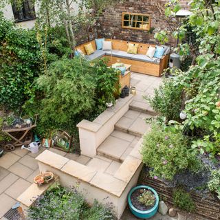 Terraced garden with seating area and steps