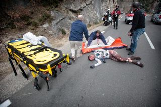 Blel Kadri (AG2R) is attended by medical staff after suffering serious injury in a crash on stage 5 of Paris-Nice.