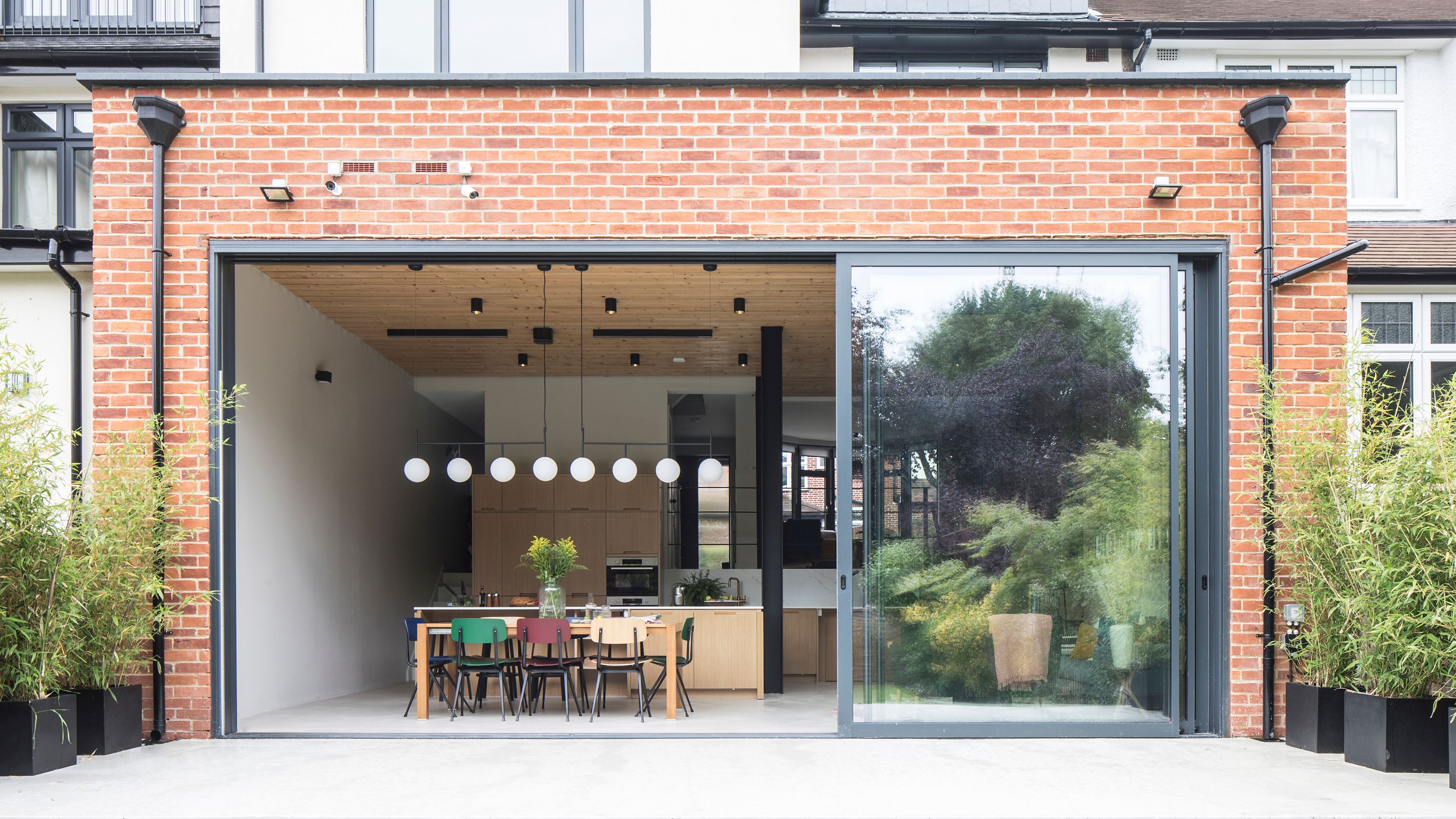 Brick extension with large aluminium sliding doors to the patio