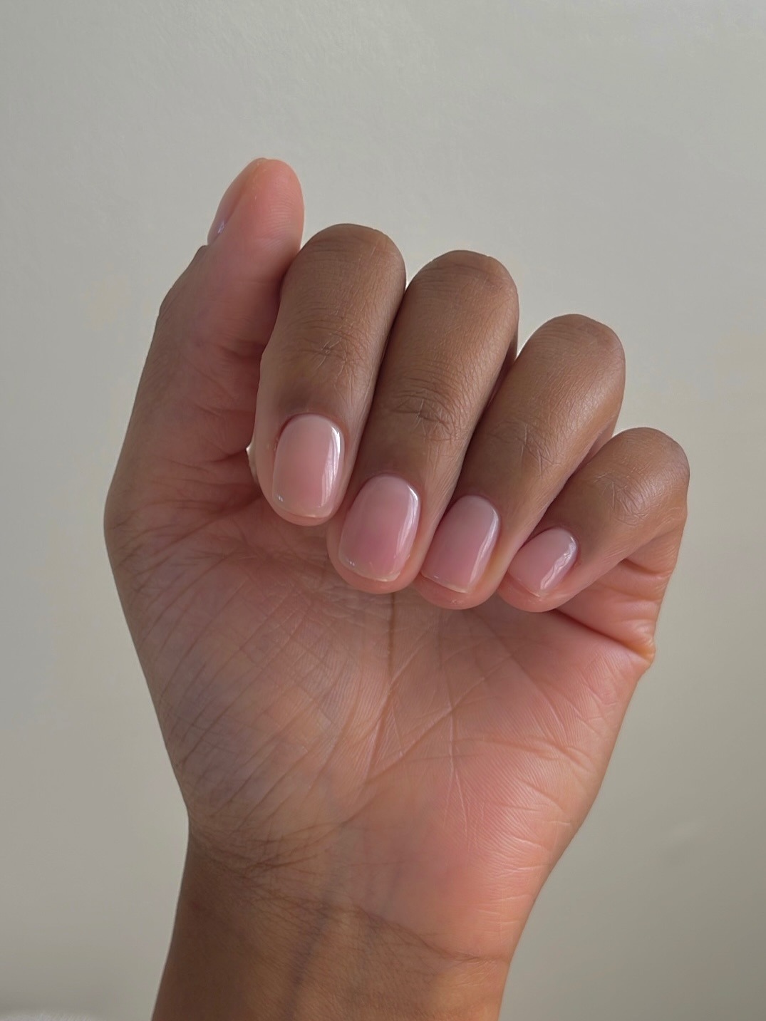 A photo of natural nails with a glossy shine