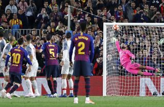 Lionel Messi curls a free-kick over the Liverpool wall and past goalkeeper Alisson Becker to give Barcelona a 3-0 win over the Reds in the teams' 2019 Champions League semi-final first leg at Camp Nou.