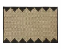A jute-look outdoor rug with black geometric patterned edging