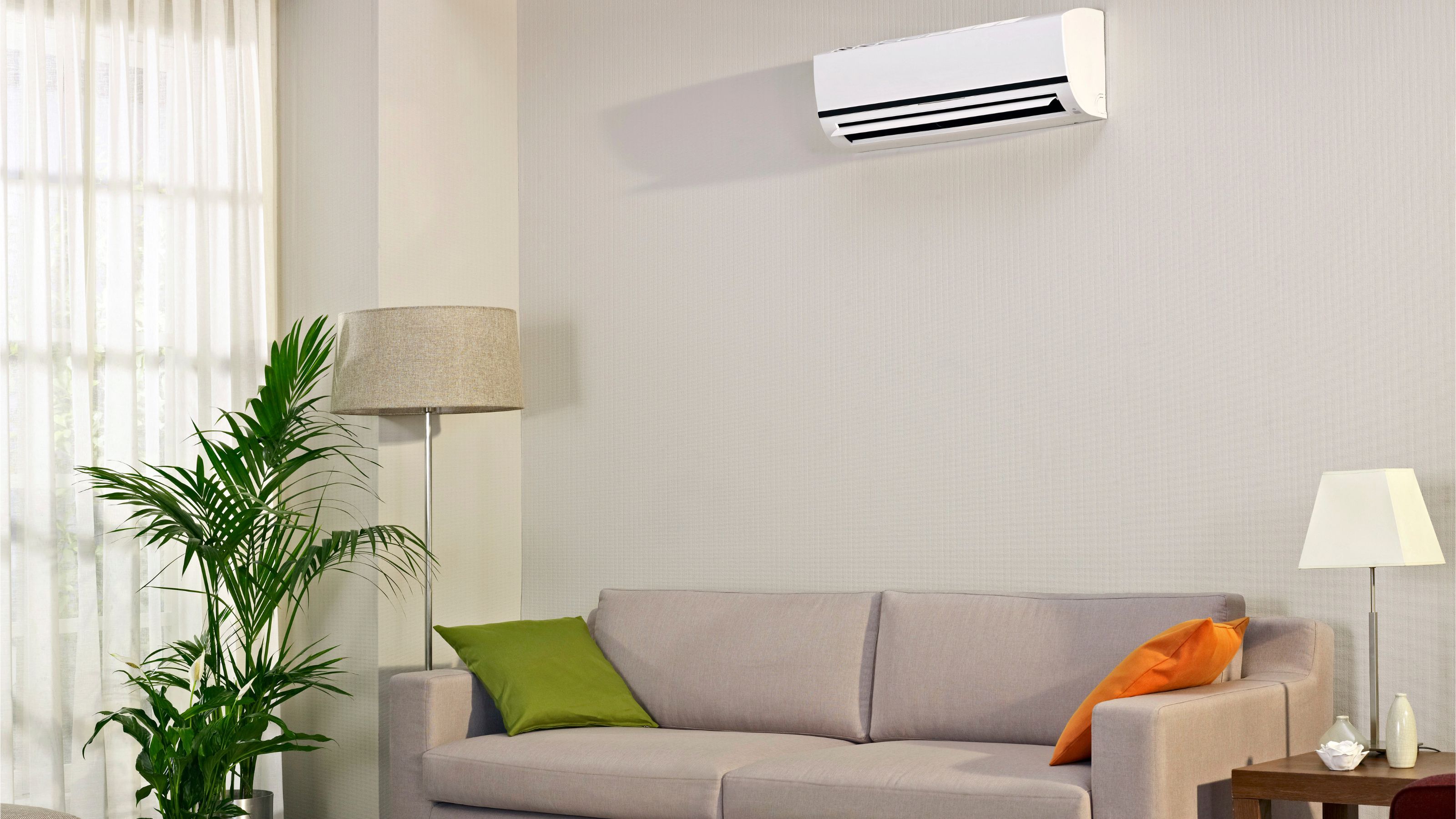 Indoor air conditioning unit installed on the wall in a living room