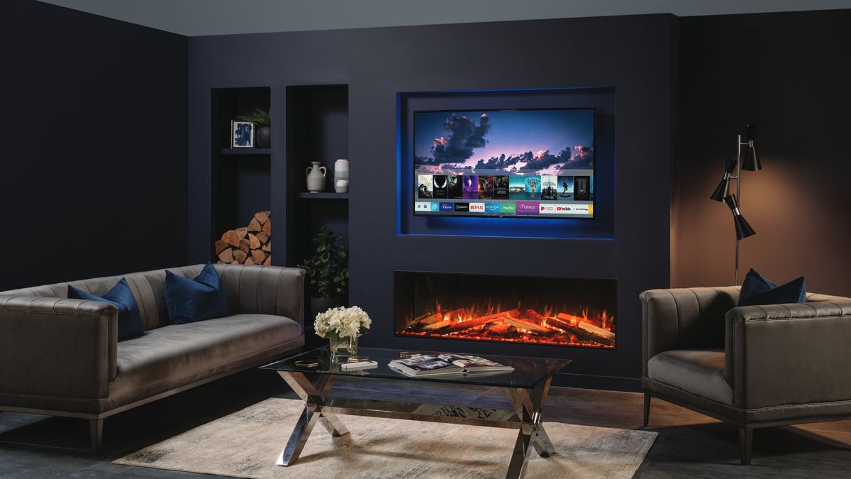 living room with dark blue walls and TV mounted in recess above long, narrow electric fire