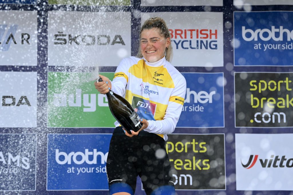 HARLOW ENGLAND JUNE 07 Clara Copponi of France and Team FDJ Nouvelle Aquitaine Futuroscope yellow leader jersey celebrates at podium as during the 8th The Womens Tour 2022 Stage 2 a 921km stage from Harlow to Harlow WomensTour UCIWWT on June 07 2022 in Harlow England Photo by Justin SetterfieldGetty Images