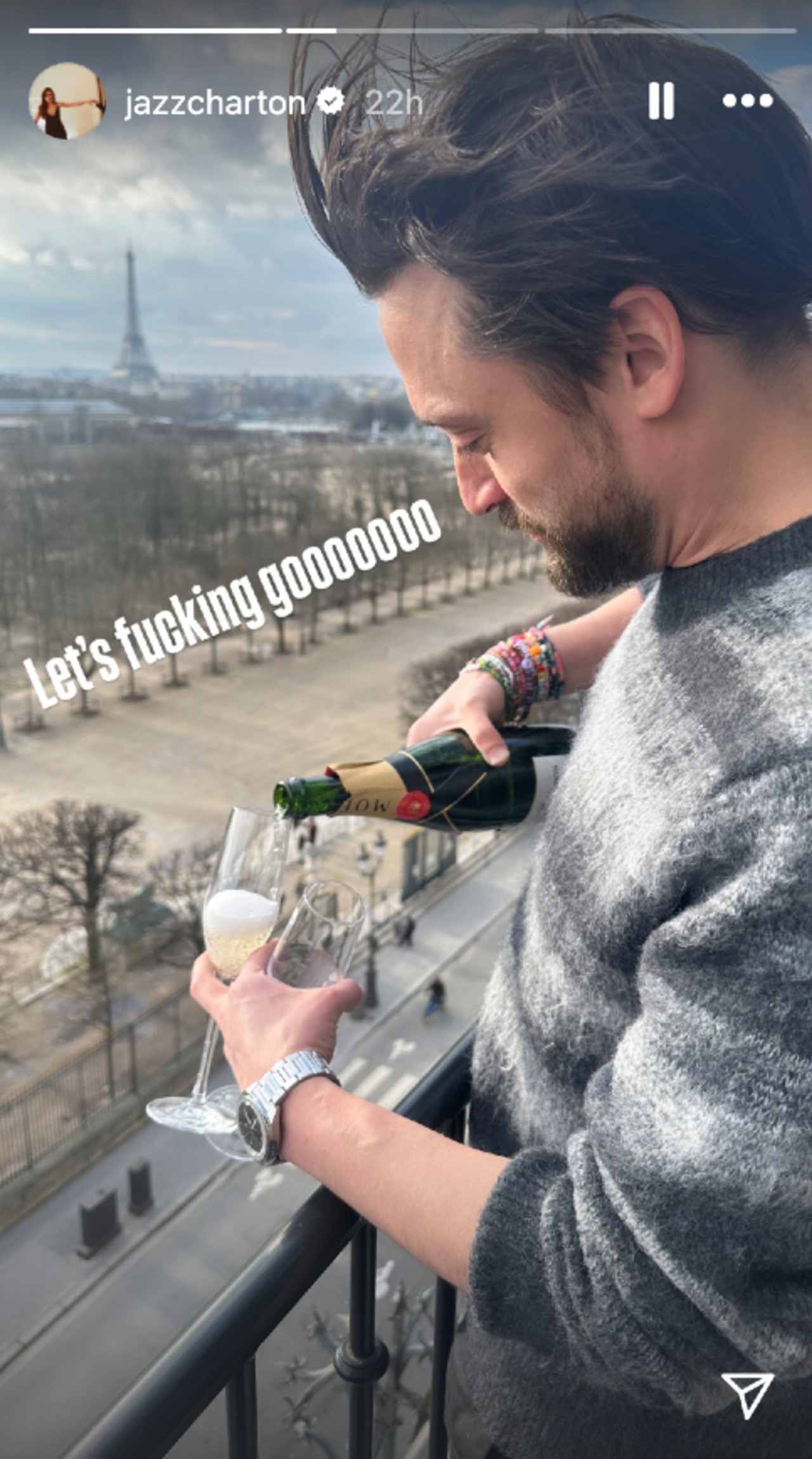 A photo of Kieran Culkin pouring a glass of champaigne while holding two glasses. Jazz Charton captioned the image with 