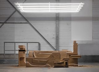 Installation of clay structures in warehouse-style space by Johanna Seelemann