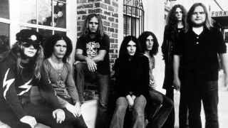 Lynyrd Skynyrd posing for a photograph outside a shop in 1973