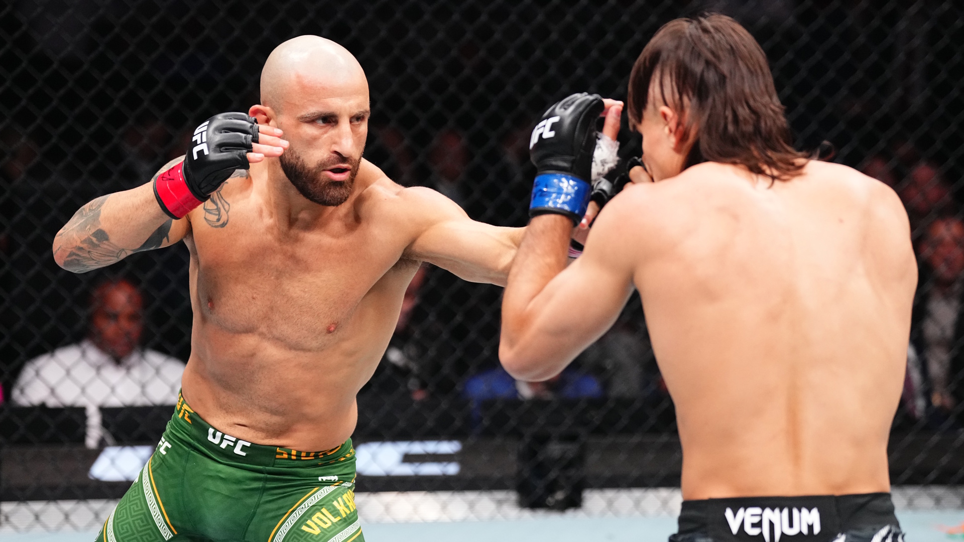Alexander Volkanovski of Australia punches Diego Lopes of Brazil in the UFC featherweight championship bout during the UFC 314 event.