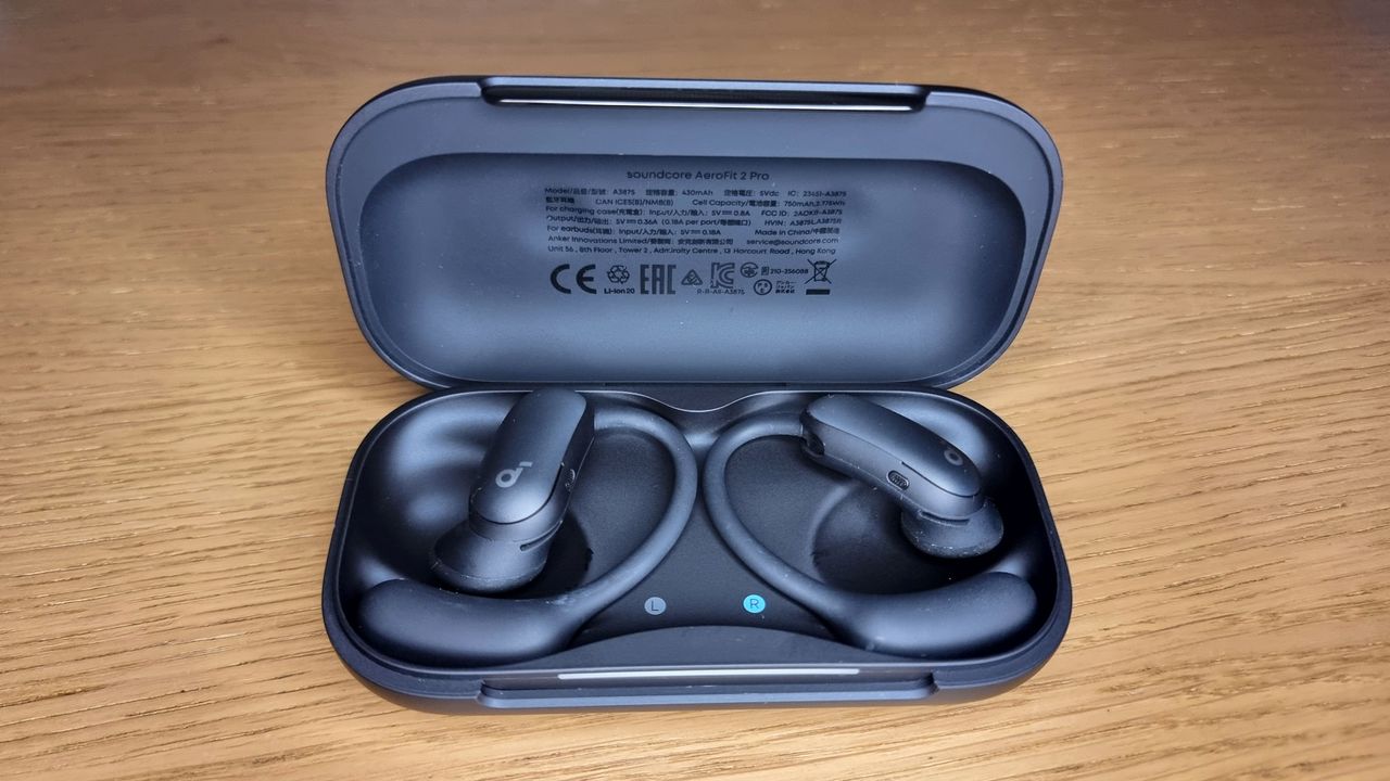A picture of the Soundcore Aerofit 2 Pro earbuds sitting in an open charging case