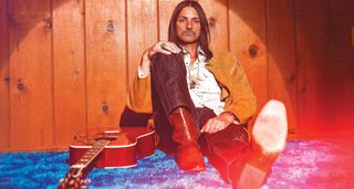 Duane Betts is pictured with his Gibson acoustic