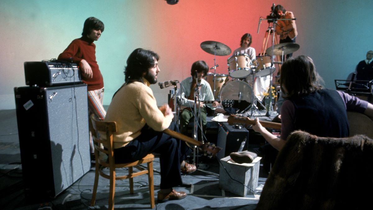 The Beatles rehearsing together at their instruments in The Beatles: Let It Be