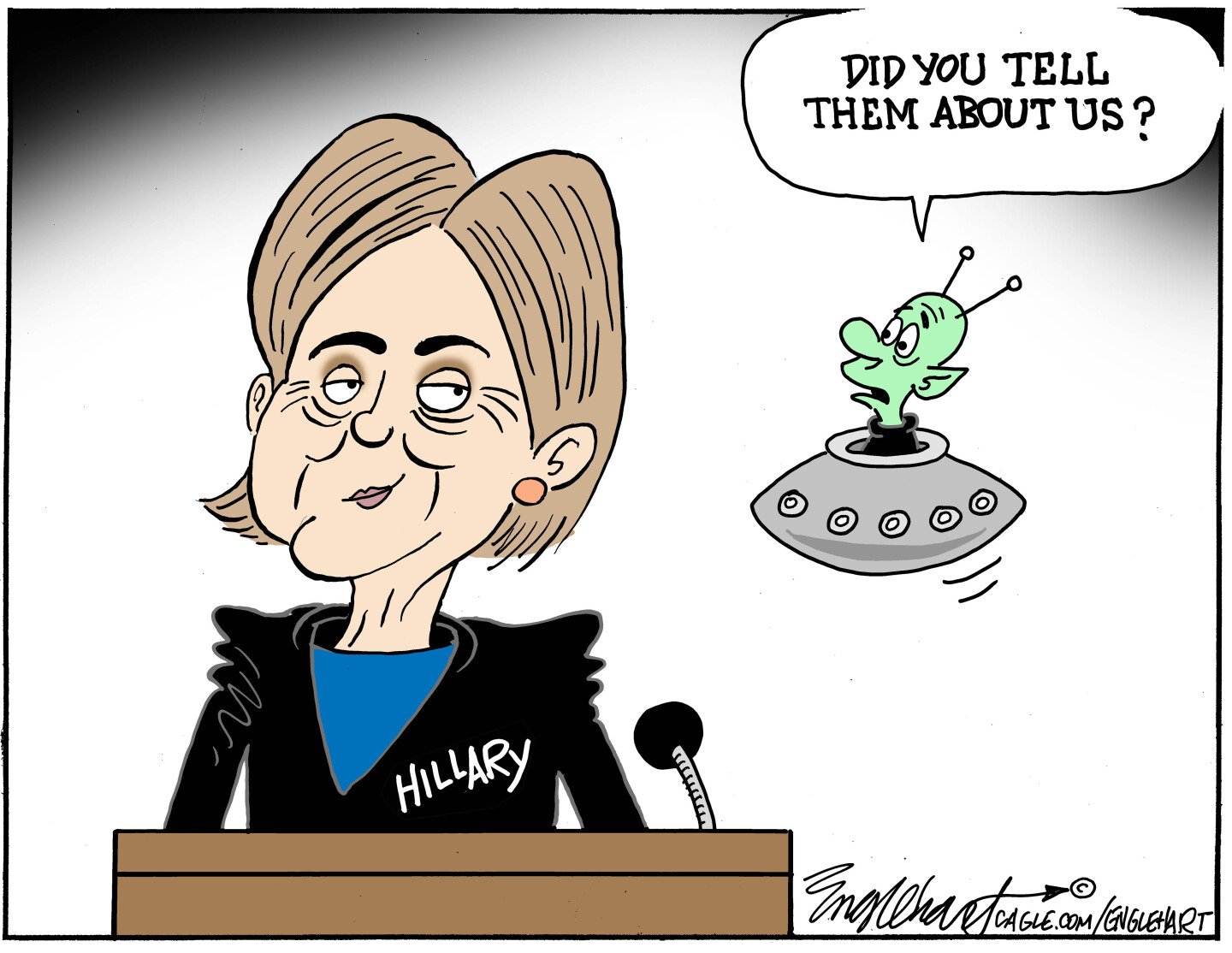 A little green alien with antennas on its head is in a flying saucer hovering next to Hillary Clinton, who has a sly smile. The alien says, 