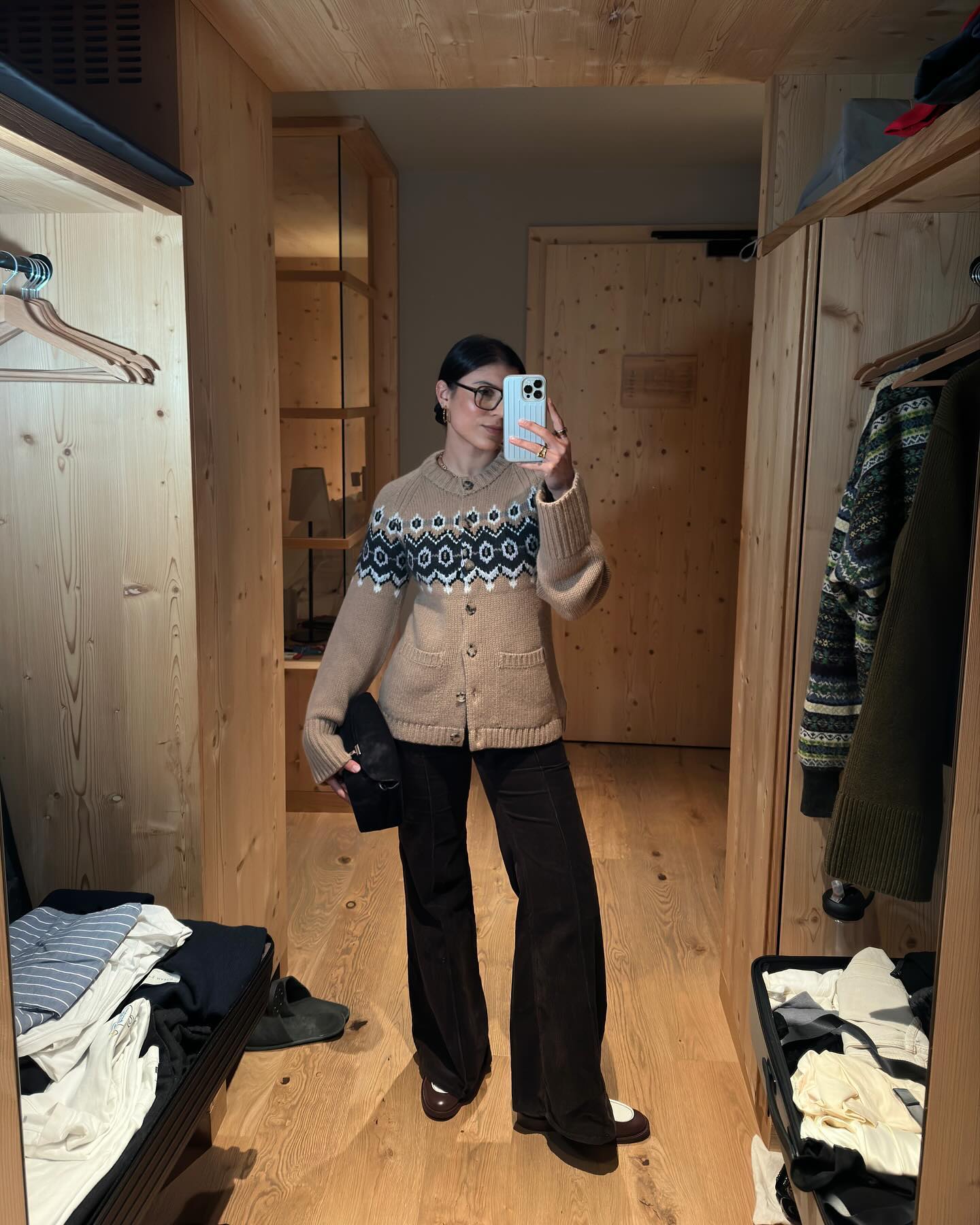 Influencer India Cardona wearing a fair isle cardigan.