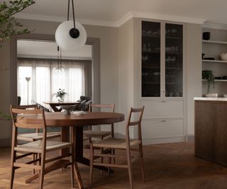 Scandinavian dining room and kitchen decorated using natural wood furniture, neutral colors and an abundance of natural and artificial light