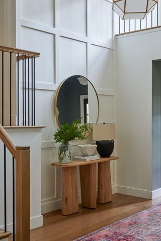 a large entryway with a wooden console table