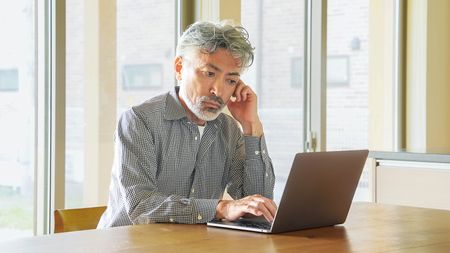 old man on computer