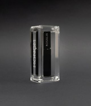 Rosalia by Italian fragrance brand Monom with black bottle in glass case