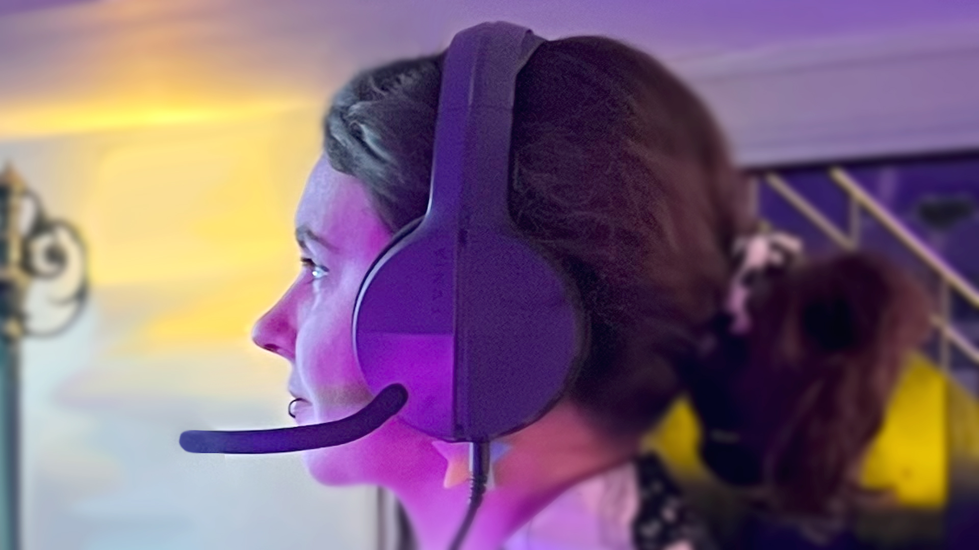 Katie Wickens wearing the low-end Evnia gaming headset