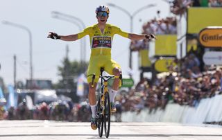 JumboVisma teams Belgian rider Wout Van Aert celebrates as he cycles past the finish line to win the 4th stage of the 109th edition of the Tour de France cycling race 1715 km between Dunkirk and Calais in northern France on July 5 2022 Photo by Thomas SAMSON AFP Photo by THOMAS SAMSONAFP via Getty Images