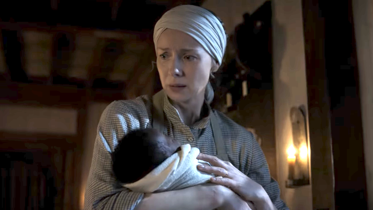 caitriona balfe as claire after she saves a baby on outlander season 8