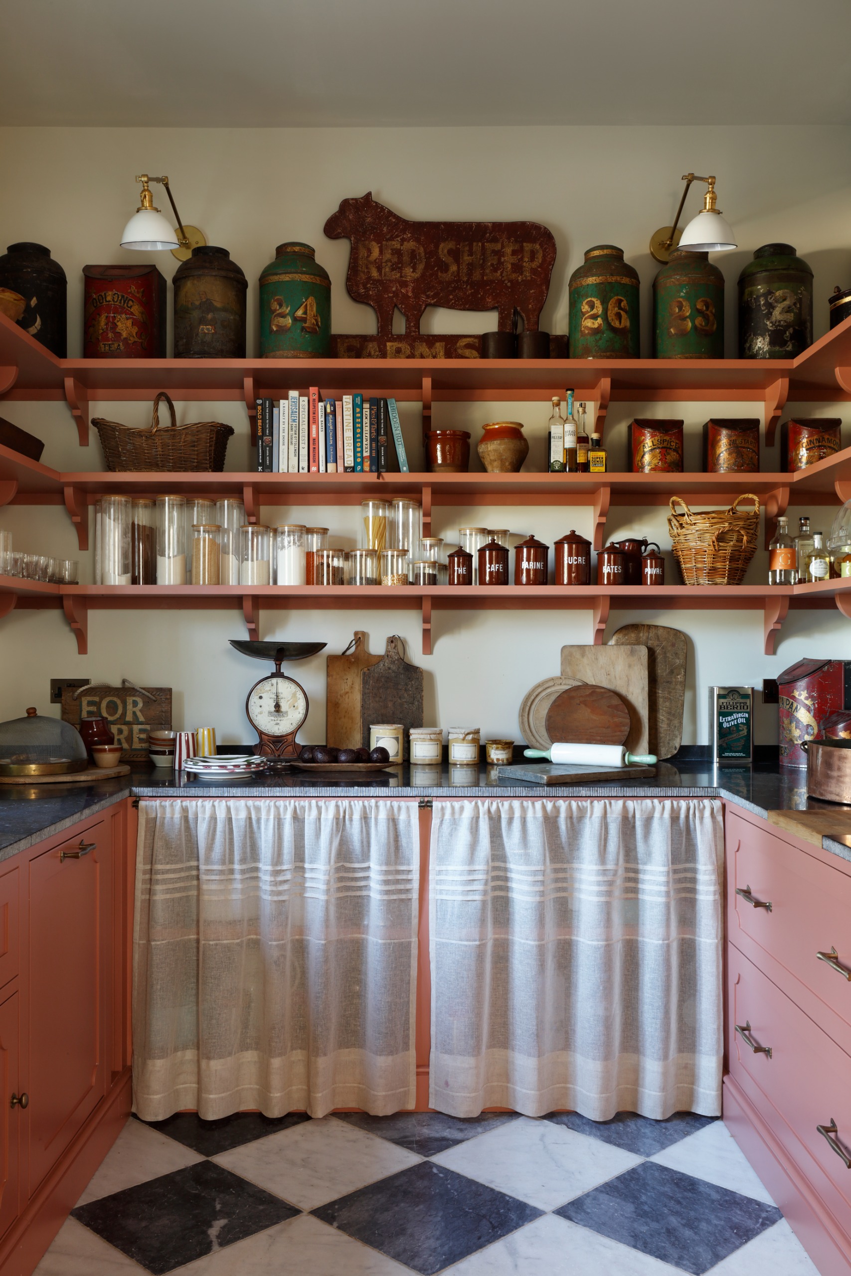 Modern-day pantry with peach-coloured shelves and cupboards
