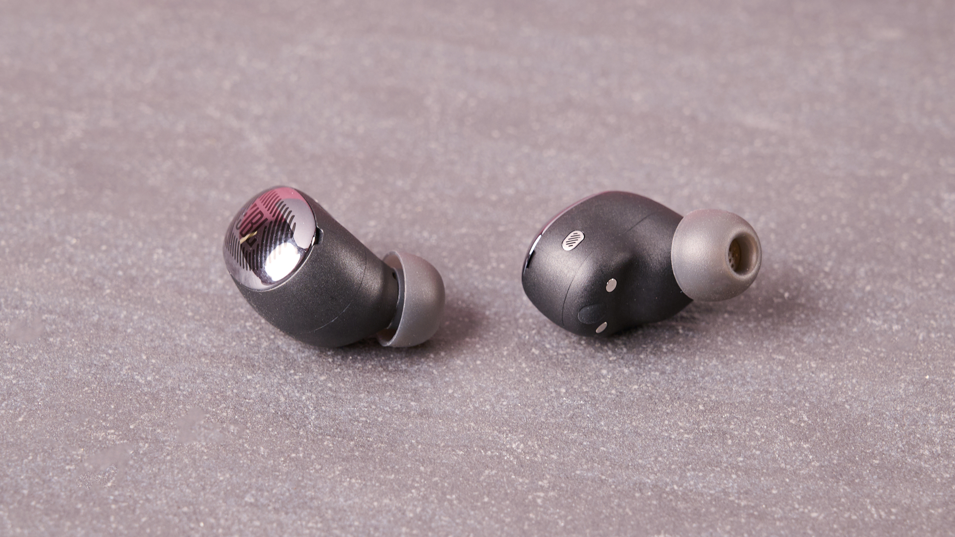JBL Live Buds 4 on table