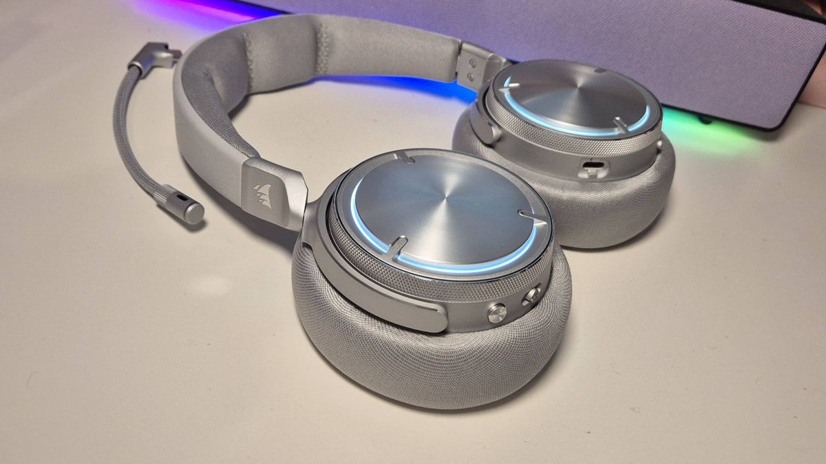 Photo of Corsair Virtuoso Max Wireless headset taken by writer Rosalie Newcombe, on a white desk.