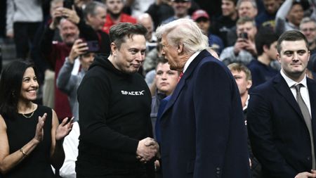 Elon Musk and Donald Trump shake hands at wrestling match