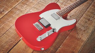 Image of a red Telecaster guitar on a wooden floor
