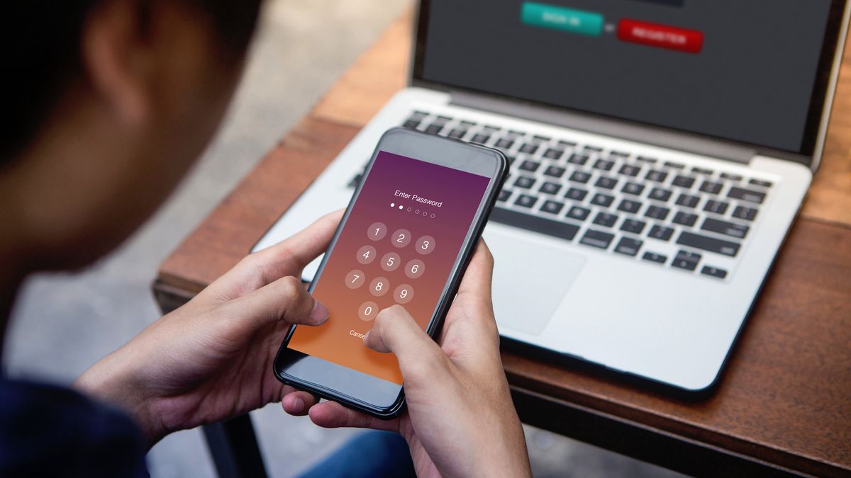 person entering passcode on smartphone