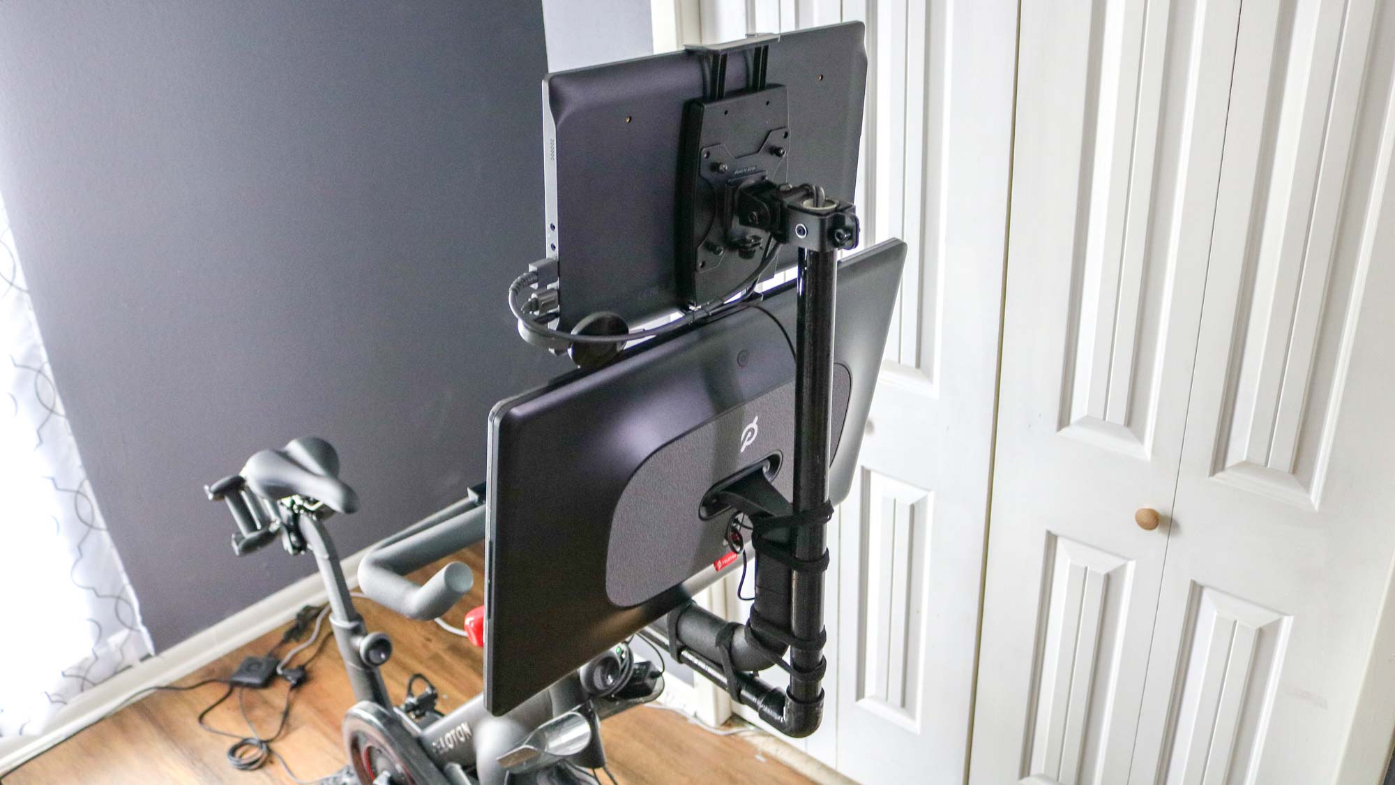 A rear shot of my DIY monitor arm for the Peloton Bike Plus