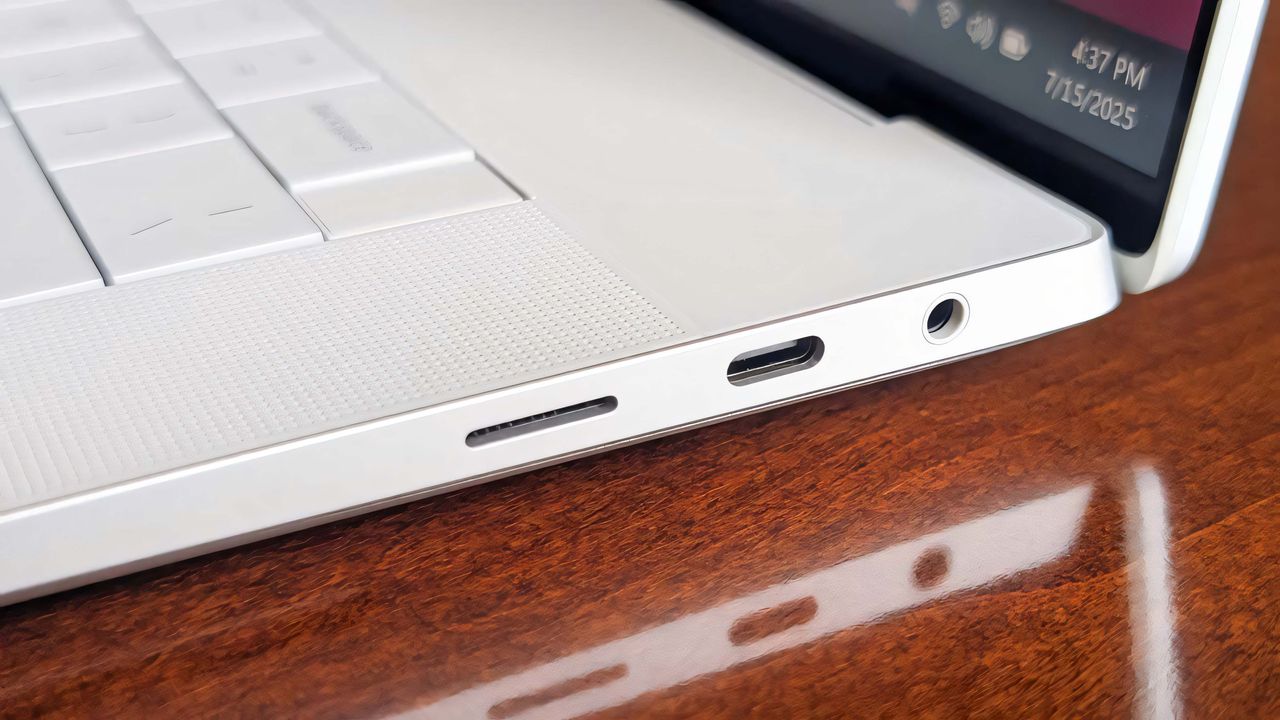 The microSD card reader, USB-C port, and headphone jack on the Dell 16 Premium's left side.