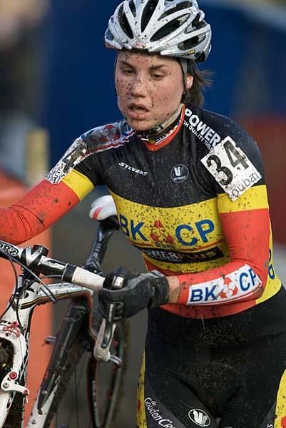 Belgium's Sanne Cant runs with her bike.