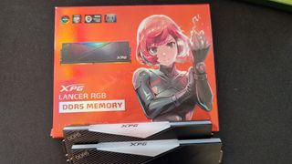 XPG Lancer RGB DDR5's box, showing an anime character securing down a gauntlet