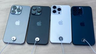 Four Apple iPhone 15 Pro Max handsets in each of the available colors