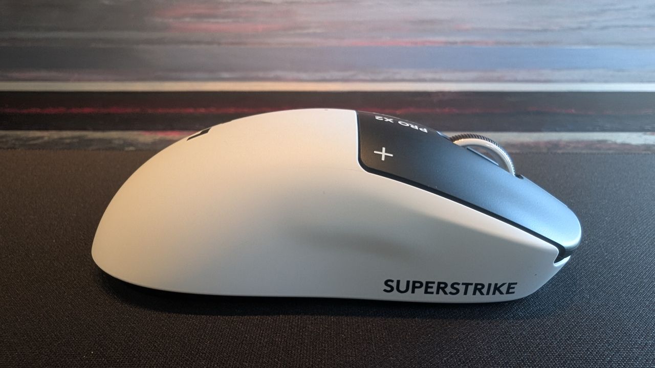 The Logitech G Pro X2 Superstrike pictured on a black mouse mat.