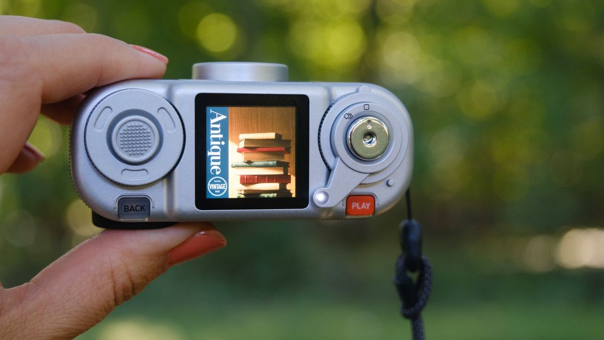 The Instax Pal 2 held in a photographer's hands