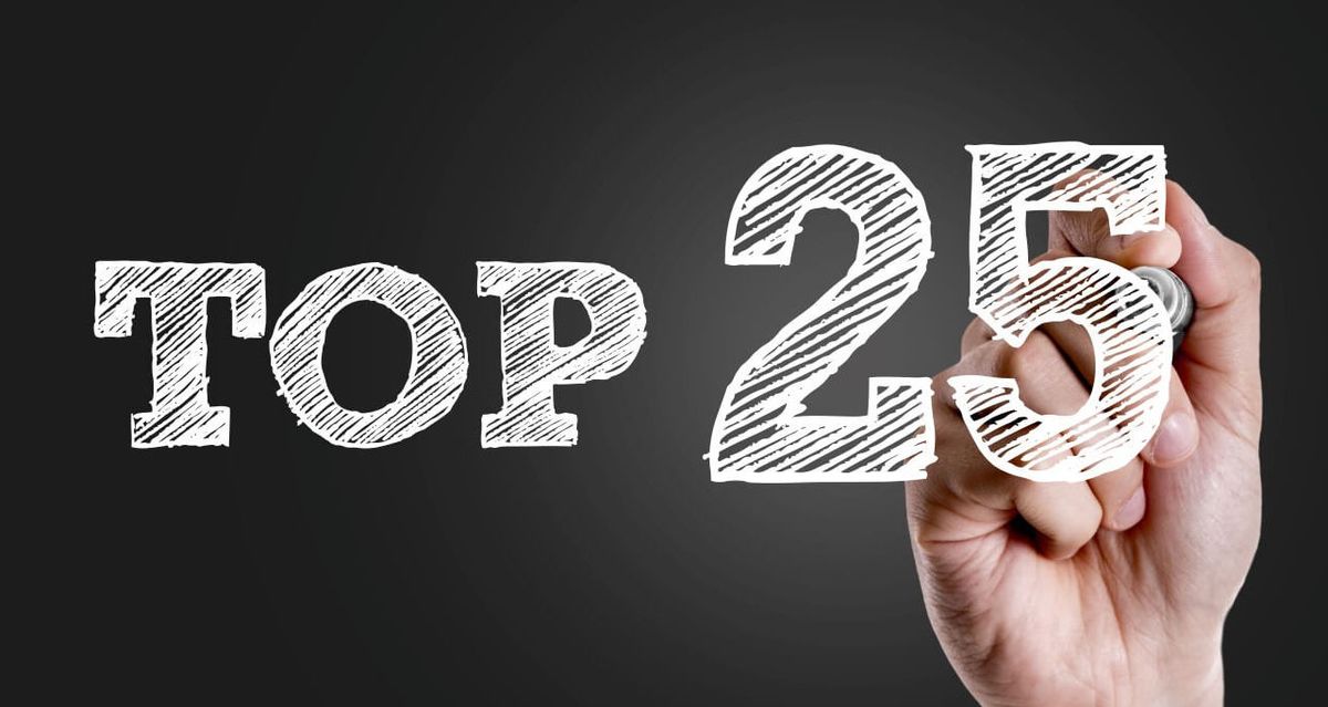 Photo Illustration: Hand writing &quot;Top 25&quot; in white marker on dark background