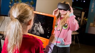 The Virtual Science Center engages students with STEM via VR/AR experiences. Here, two middle schoolers explore how Oculus head tracking works via an ARKit enabled iPad.