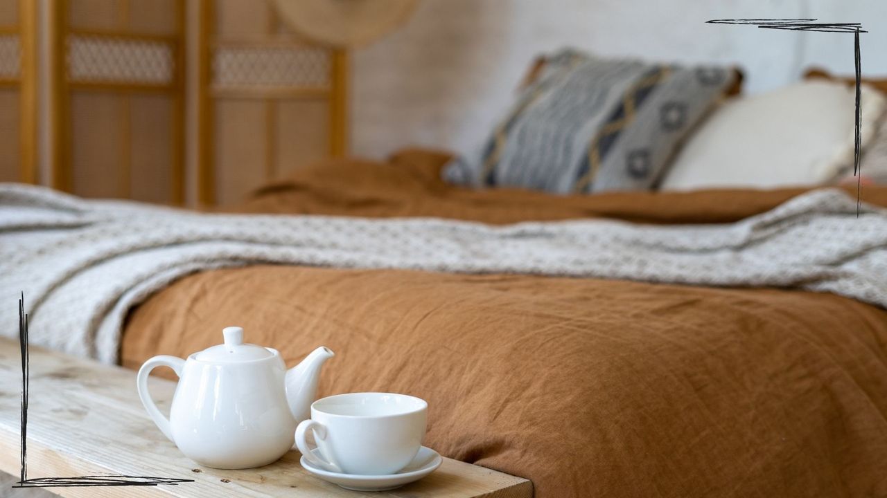 A photo of a bed with linen covers as an example of what are the softest sheets