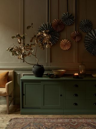 Christmas sideboard with gold leaves and paper pinwheels by Neptune