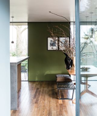 Light-filled home with green walls by Farrow & Ball