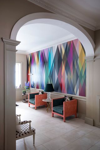 Hallway with bold wallpaper by Cole & Son